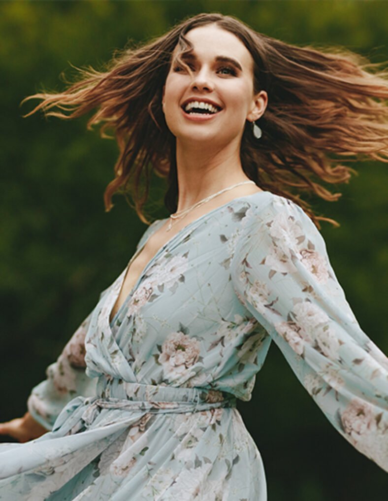 lady dancing in dress smiling