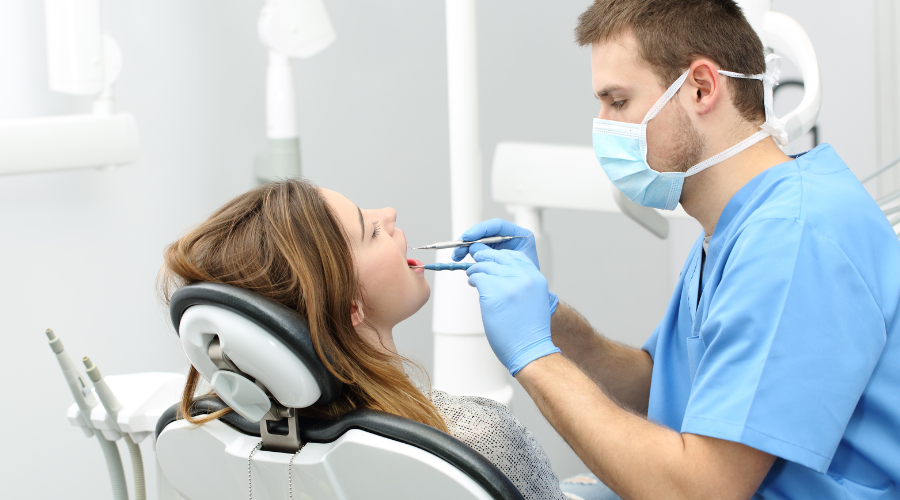 Wisdom Tooth Extractions dentist doing a check up