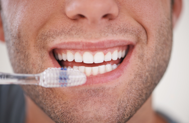 Man brushing teeth